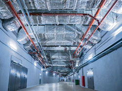 Image of corridor with heating pipes in ceiling