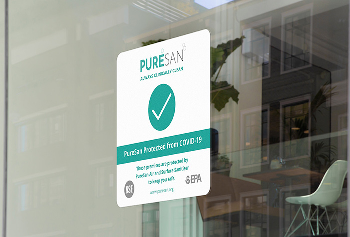 A sticker on a shop window saying the property is protected by PureSan's Room Sanitiser Syster