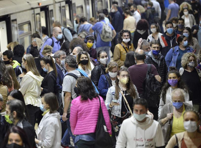 People wearing face masks on the tube