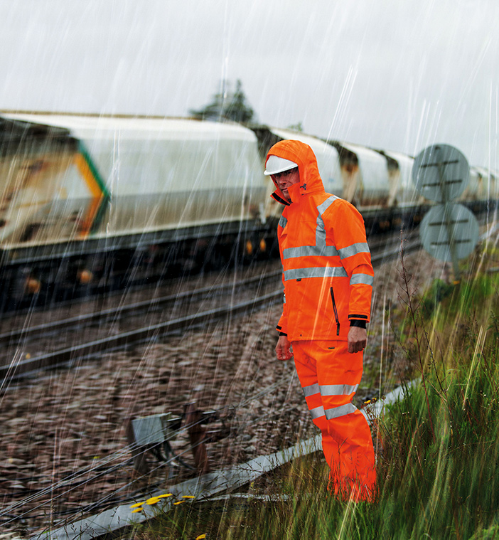 Man wearing reflective high-vis PPE in the rain