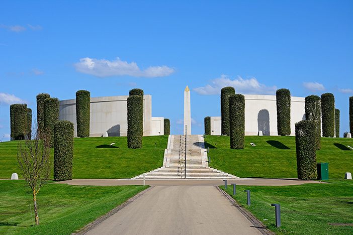 A wide image of the National Memorial Arboretum against a blue skied sunny day