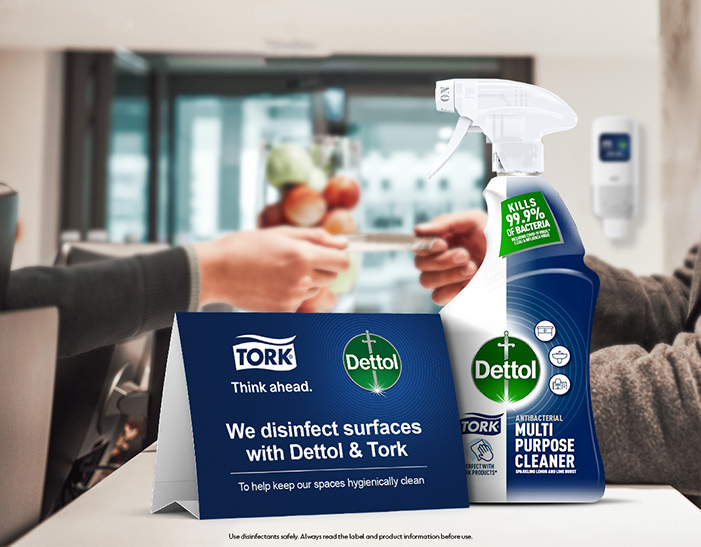 Dettol and Tork cleaning products on a table