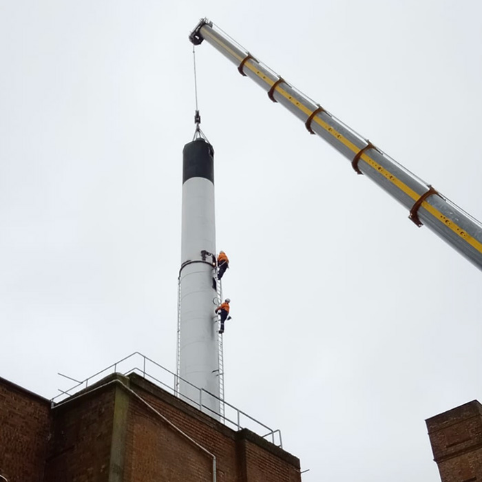 PTSG workman working safely at height on a chimney