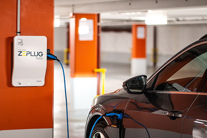 An Electric vehicle being charged by a Zeplug unit