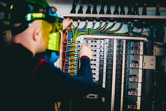 A PTSG engineer performing electrical compliance testing