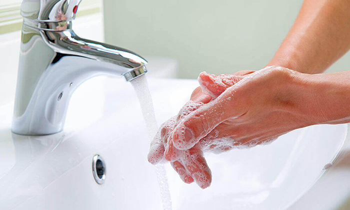 A person washing their hands